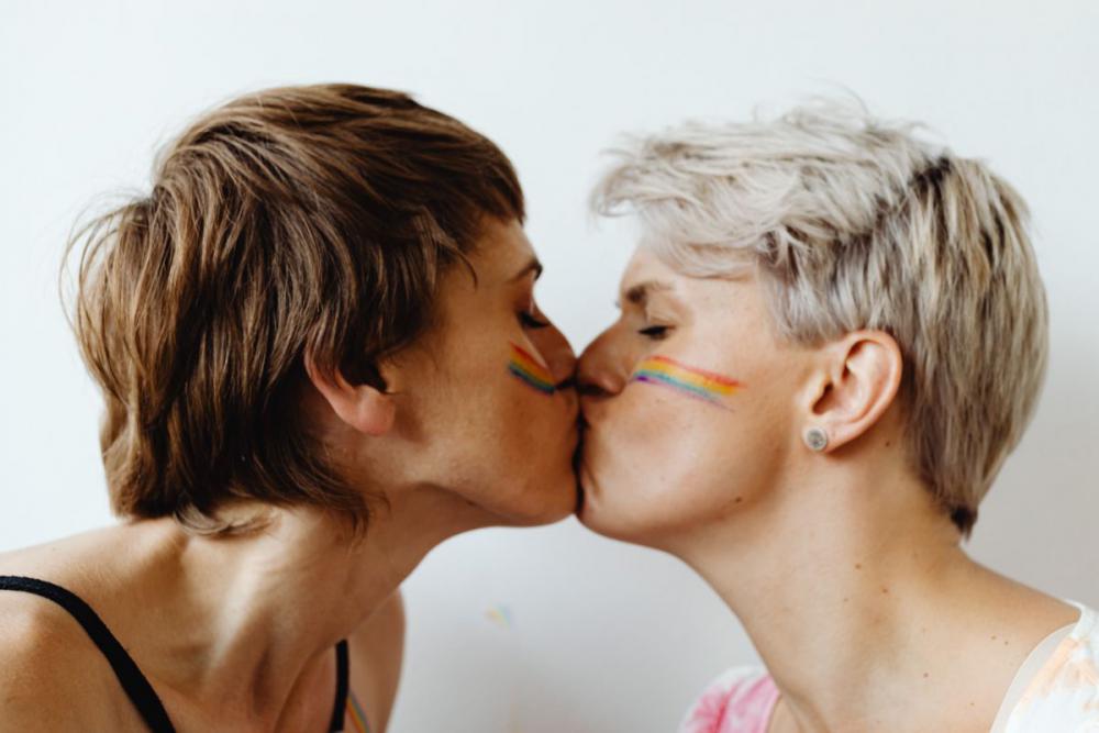 Girls paint an LGBT rainbow on their bodies Girls paint an LGBT rainbow on their bodies