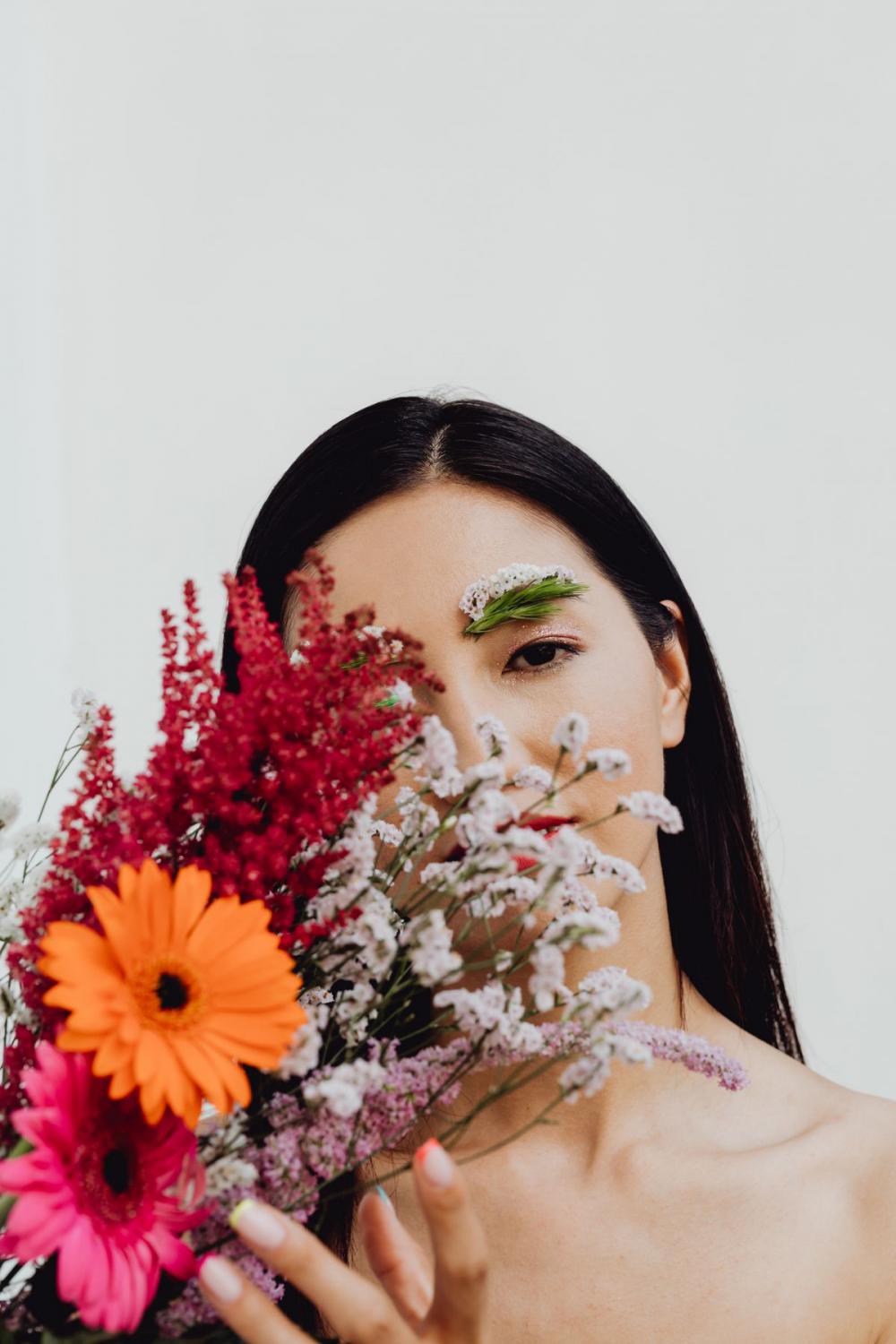 Sensual Portrait Of A Asian Woman With Flowers On Her Face Sensual Portrait Of A Asian Woman With Flowers On Her Face