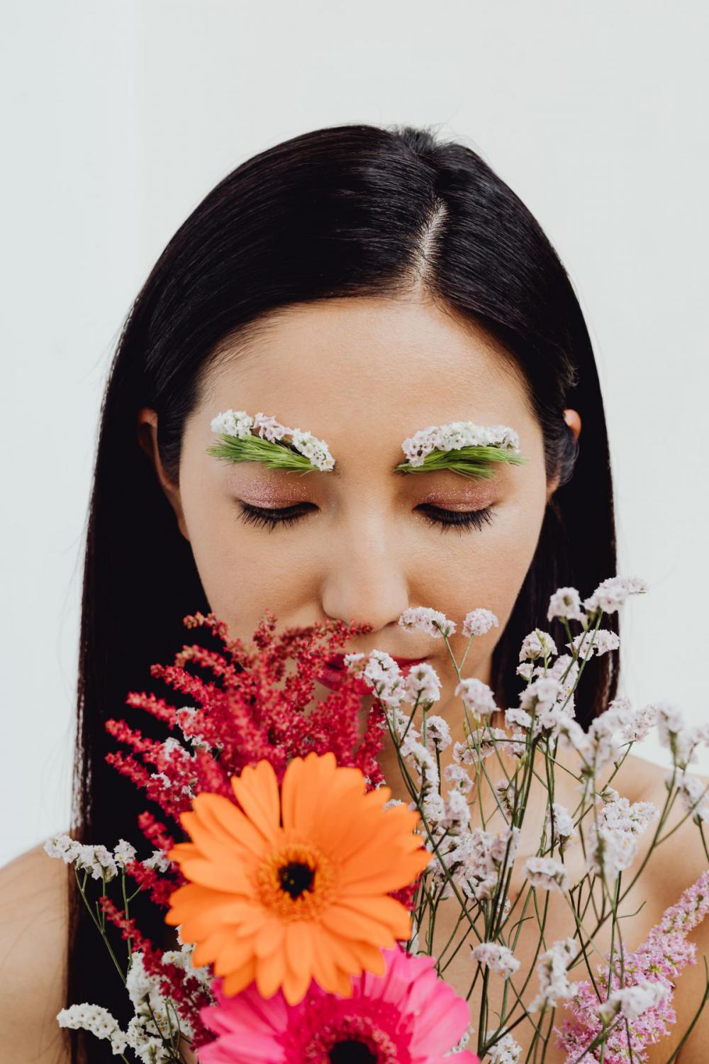 Sensual Portrait Of A Asian Woman With Flowers On Her Face Sensual Portrait Of A Asian Woman With Flowers On Her Face