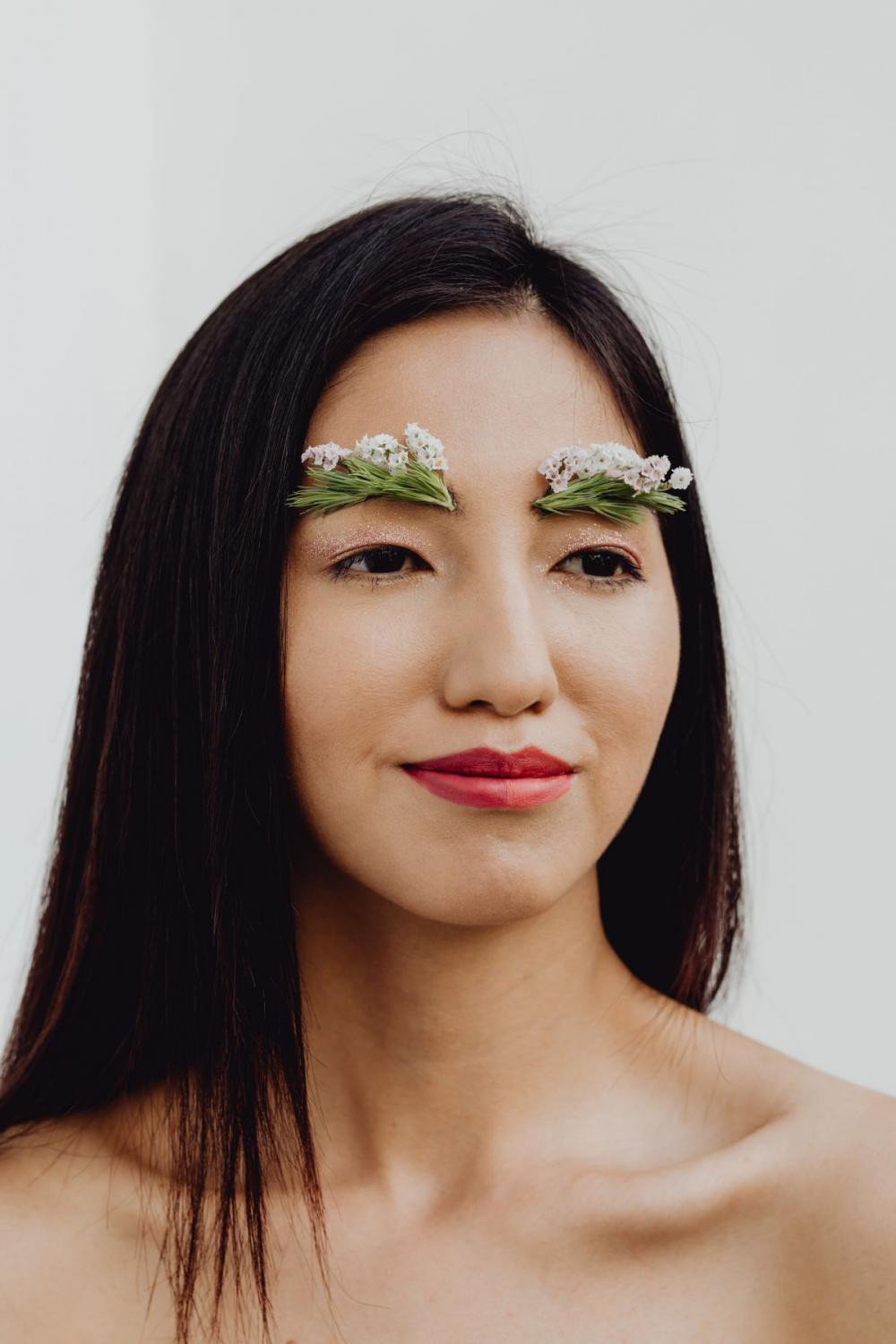 Sensual Portrait Of A Asian Woman With Flowers On Her Face Sensual Portrait Of A Asian Woman With Flowers On Her Face