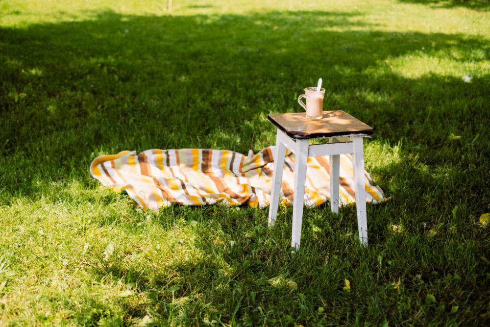 Cup of coffee on a vintage stool outdoors 2 Cup of coffee on a vintage stool outdoors 2