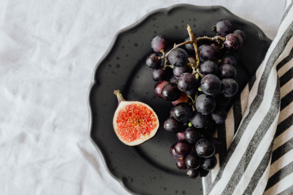 Fruits on a black stoneware plate Fruits on a black stoneware plate