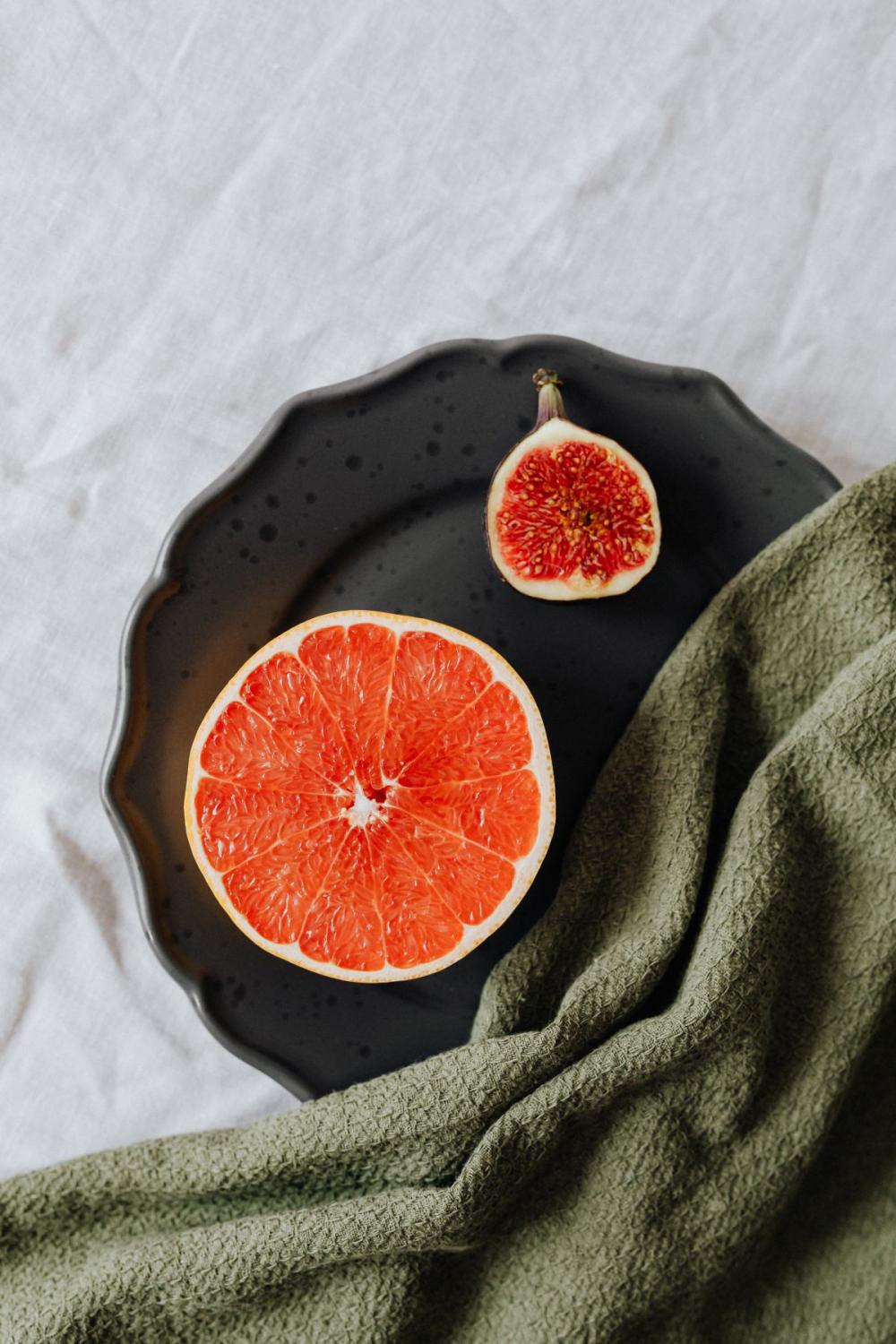 Fruits on a black stoneware plate Fruits on a black stoneware plate