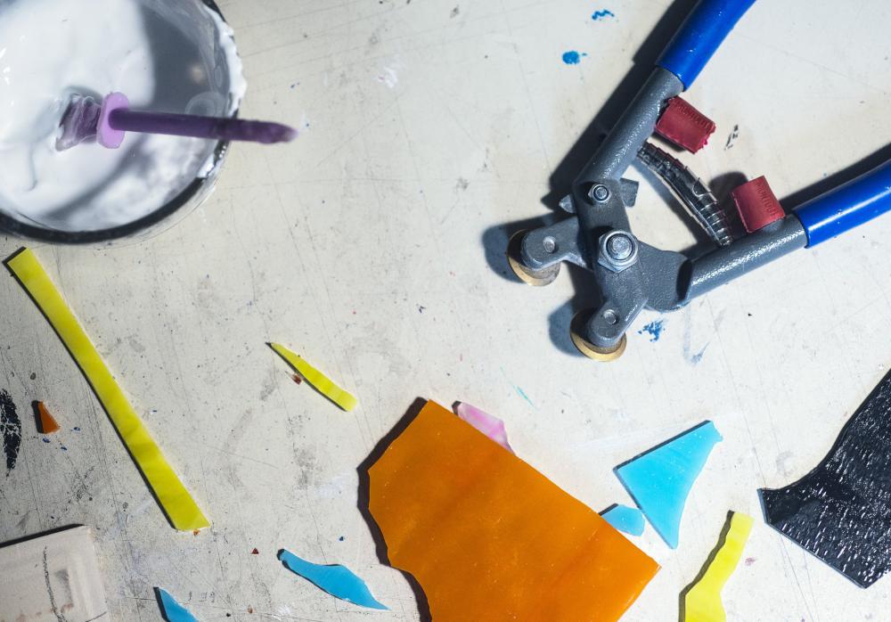 Flatlay Of A Mosaic Artists Tools With Cut Glass Photo Flatlay Of A Mosaic Artists Tools With Cut Glass Photo
