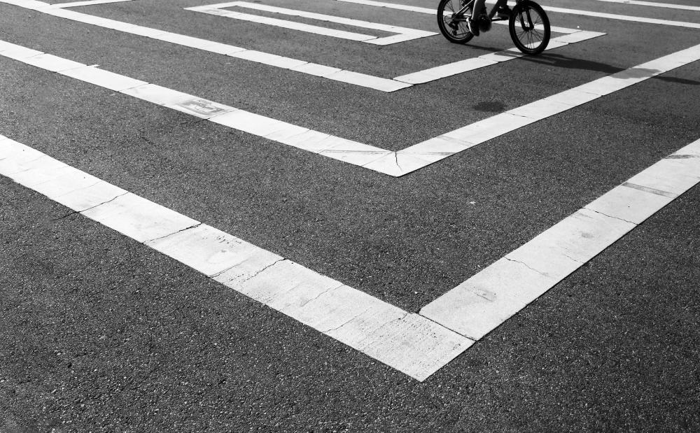 Black And White Photo Of White Lines On Wet Pavement Photo Black And White Photo Of White Lines On Wet Pavement Photo