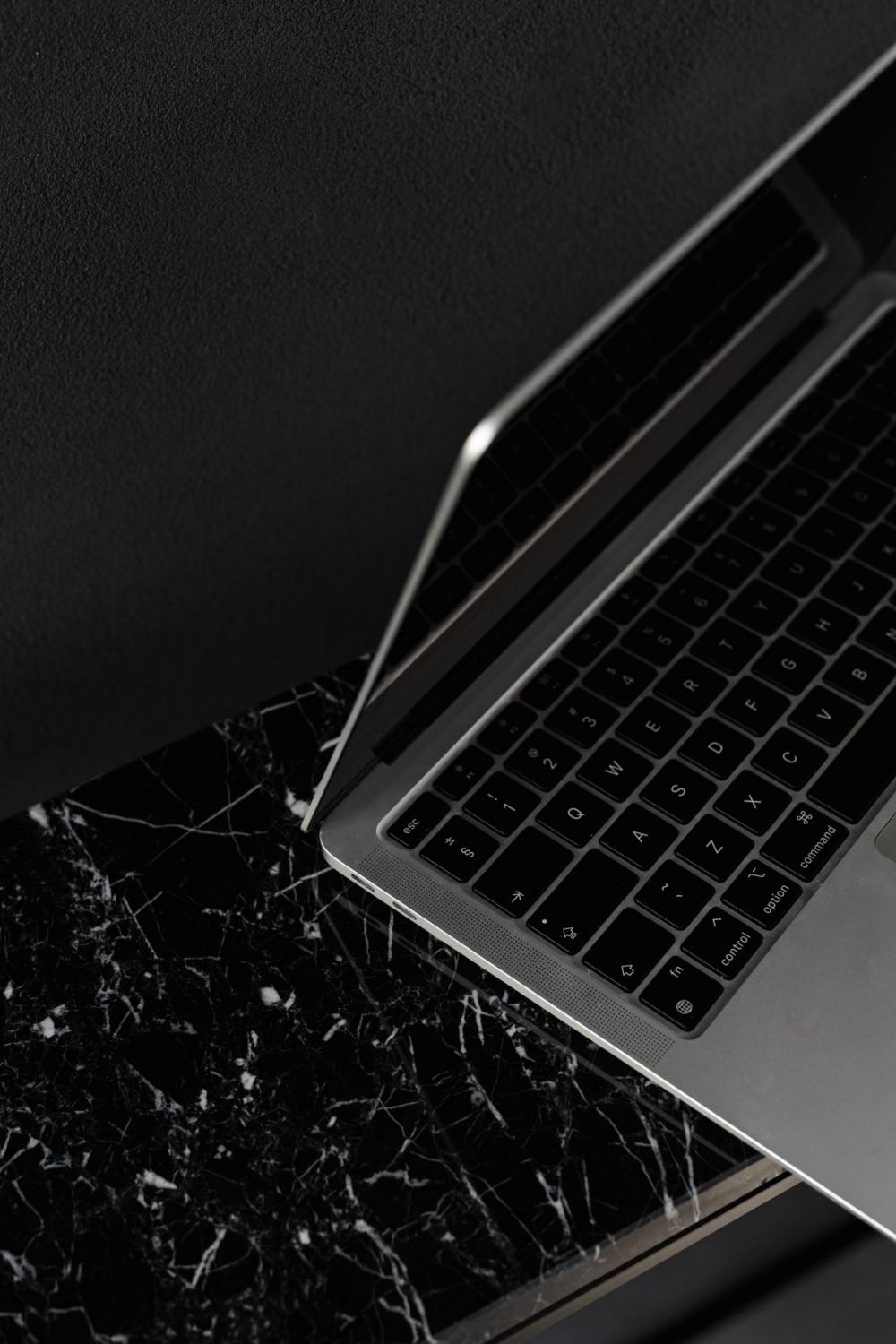 Macbook Pro laptop - marble - decorative plaster on wall - black aesthetics Macbook Pro laptop - marble - decorative plaster on wall - black aesthetics