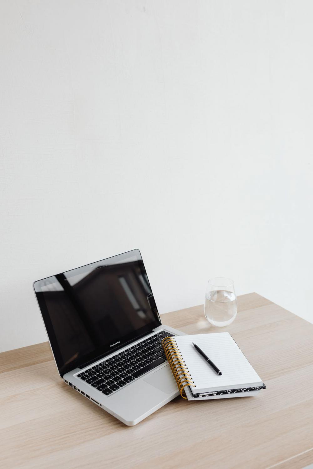 Workspace - laptop - AirPods - desk - notebooks - mobile phone Workspace - laptop - AirPods - desk - notebooks - mobile phone