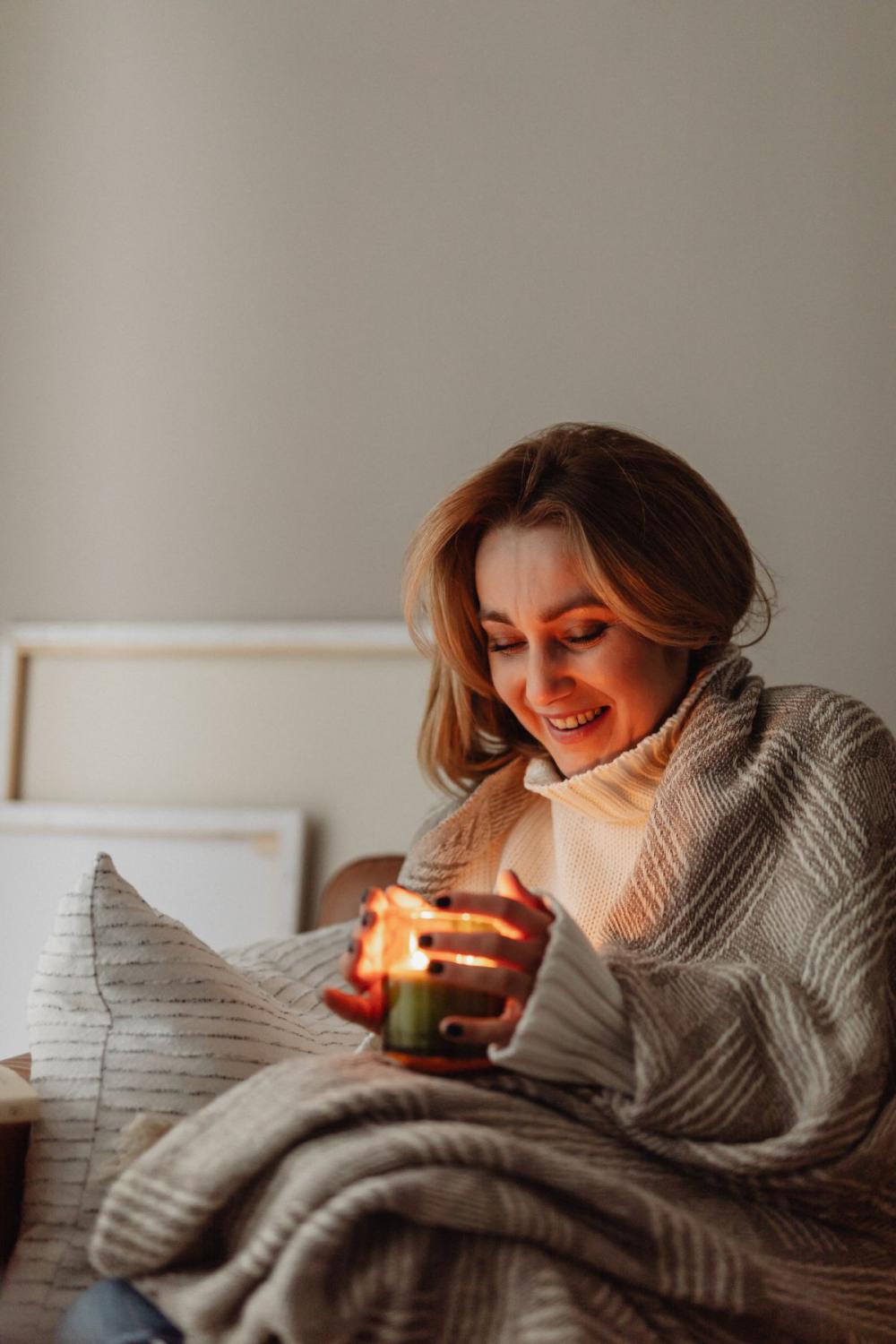 Cocooning - isolating yourself - stay at home - woman under blanket Cocooning - isolating yourself - stay at home - woman under blanket