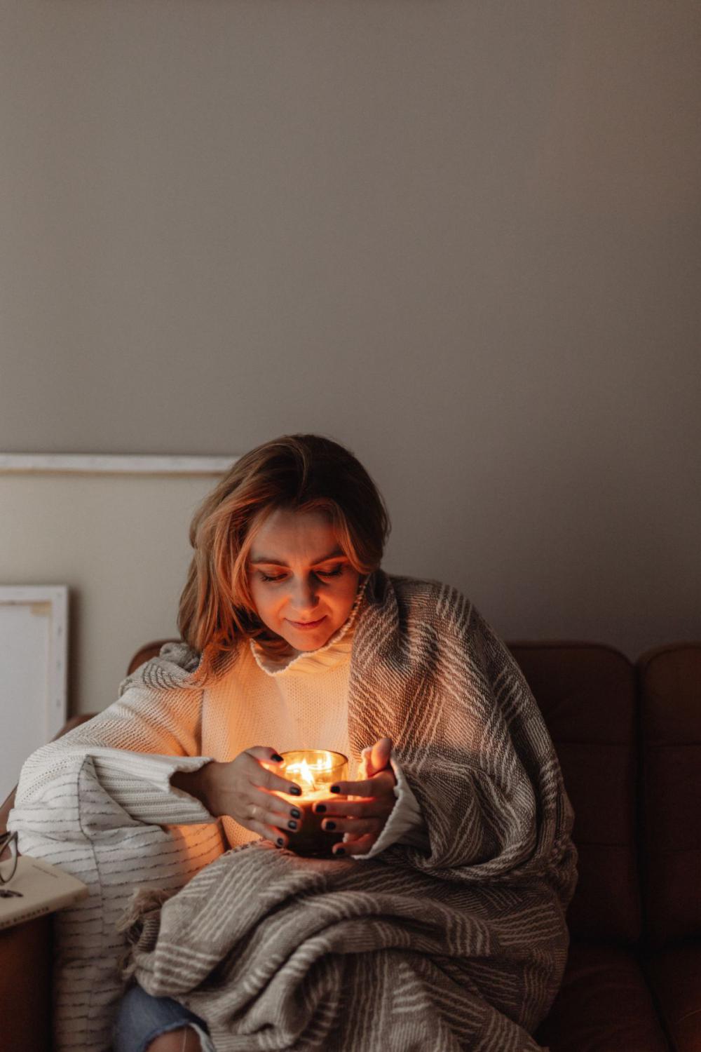 Cocooning - isolating yourself - stay at home - woman under blanket Cocooning - isolating yourself - stay at home - woman under blanket