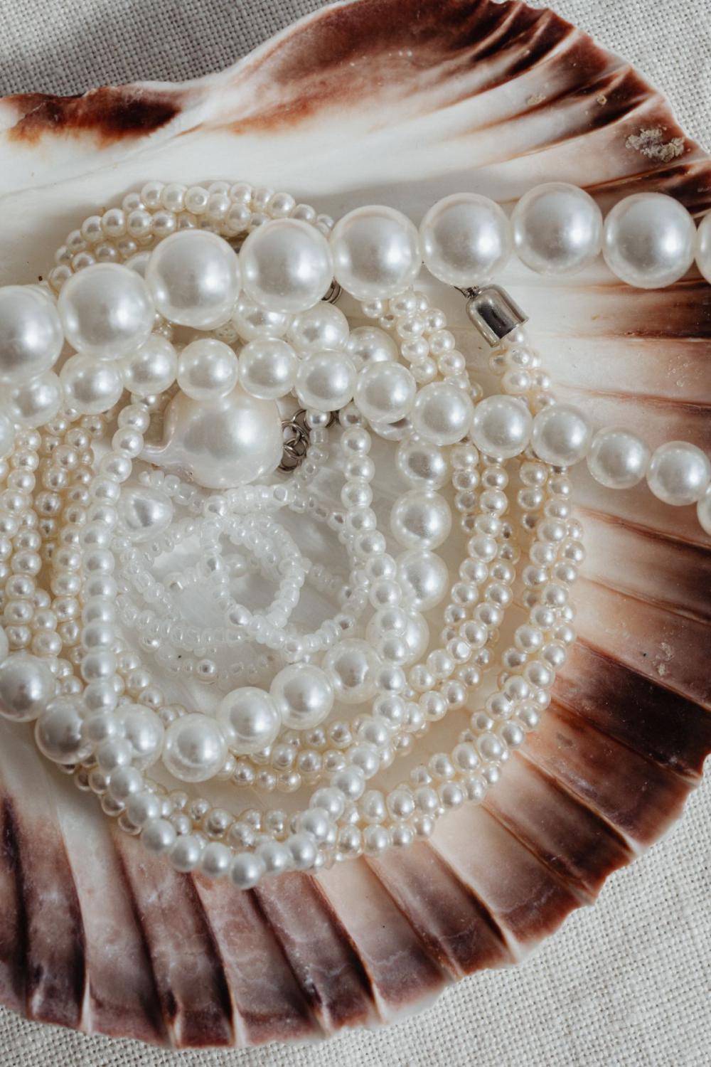 Pearl jewelry - backgrounds - flatlays - from above Pearl jewelry - backgrounds - flatlays - from above