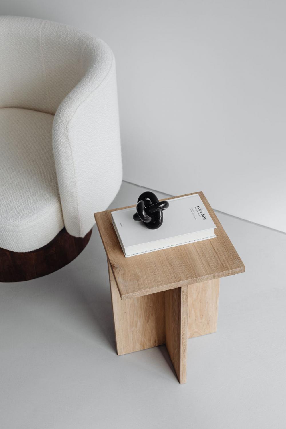 Modern oak side table - armchair with light boucle fabric - minimalist interior Modern oak side table - armchair with light boucle fabric - minimalist interior
