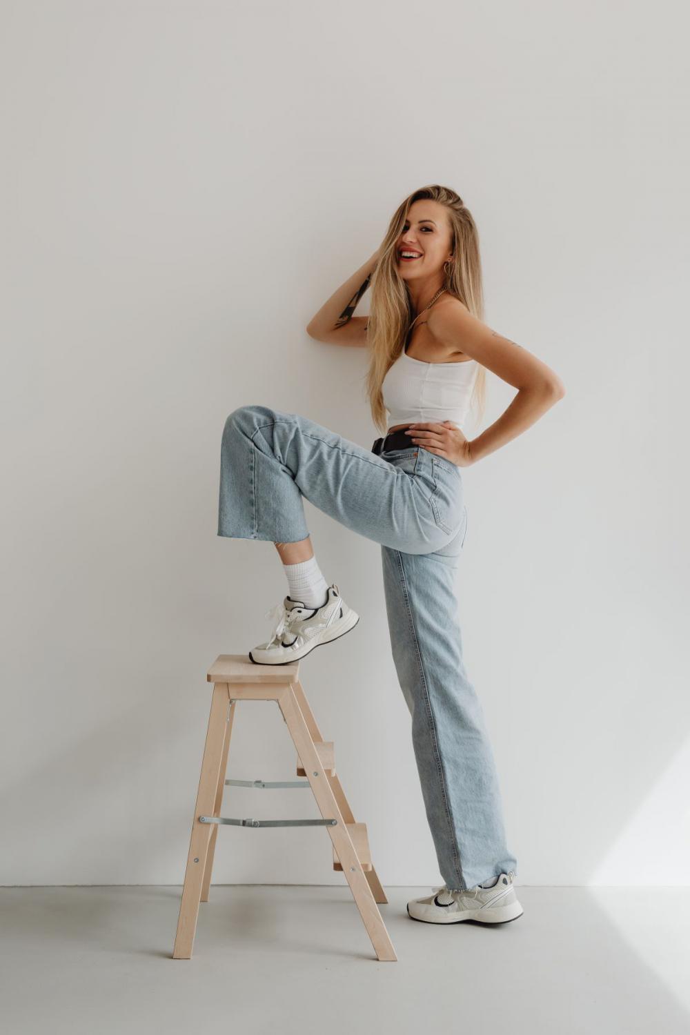 Stylish woman in high waisted wide leg jeans Stylish woman in high waisted wide leg jeans