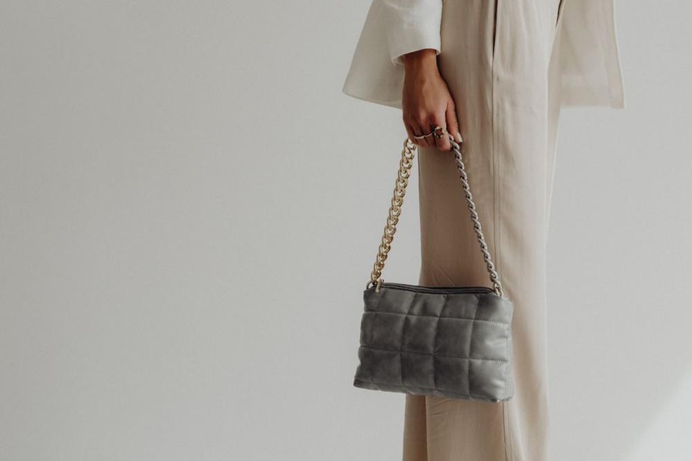 Anonymous female in trendy outfit with bag Anonymous female in trendy outfit with bag