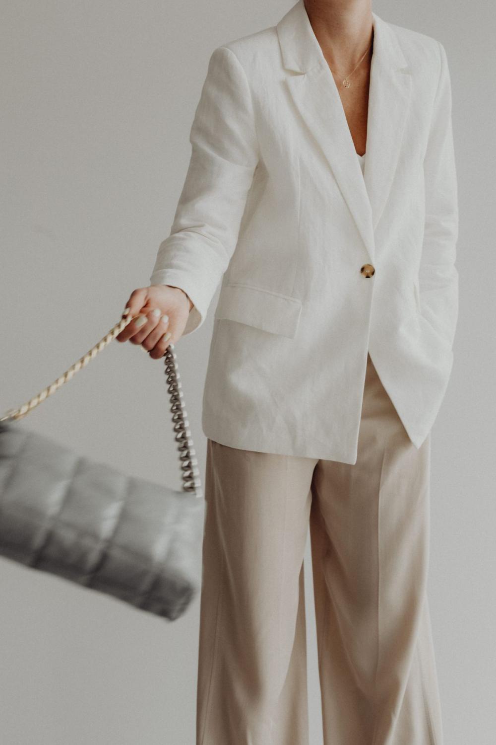 Anonymous female in trendy outfit with bag Anonymous female in trendy outfit with bag