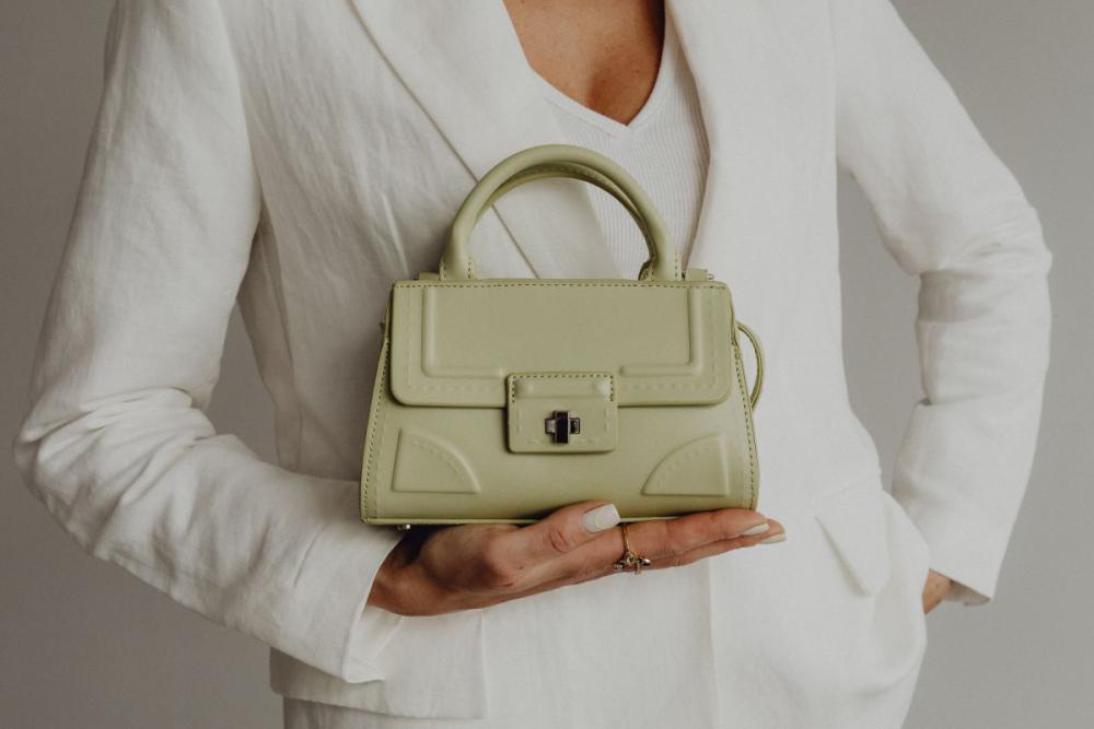 Anonymous female in trendy outfit with bag Anonymous female in trendy outfit with bag