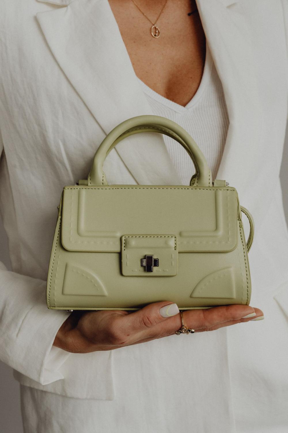 Anonymous female in trendy outfit with bag Anonymous female in trendy outfit with bag
