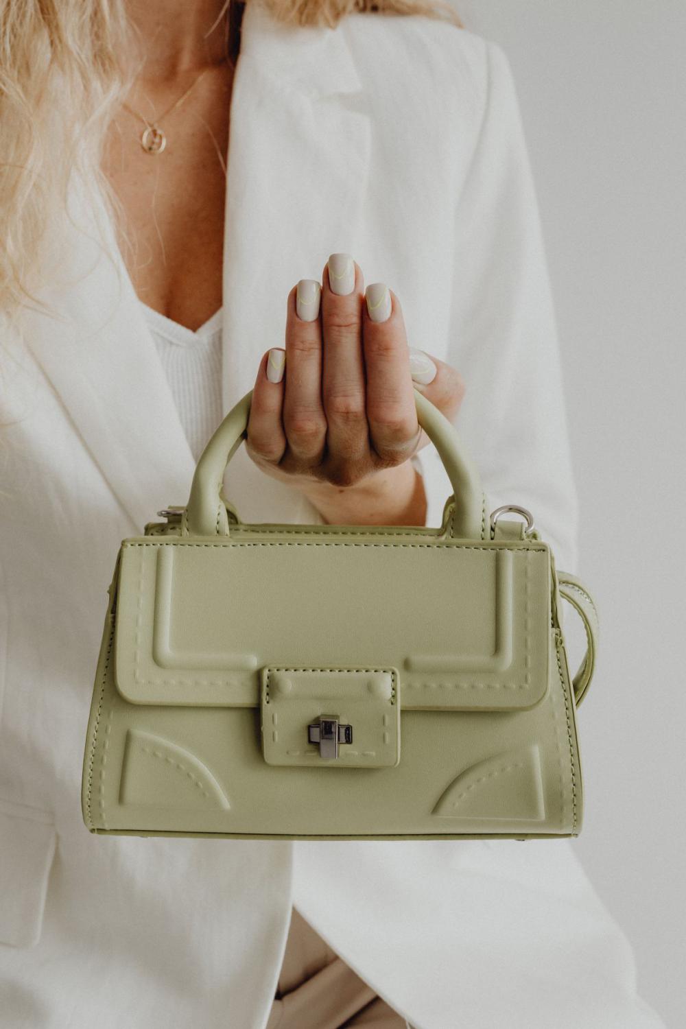Anonymous female in trendy outfit with bag Anonymous female in trendy outfit with bag