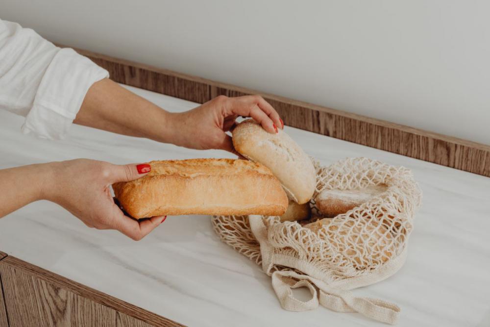Fresh bread on the kitchen counter - ciabatta - baguette Fresh bread on the kitchen counter - ciabatta - baguette