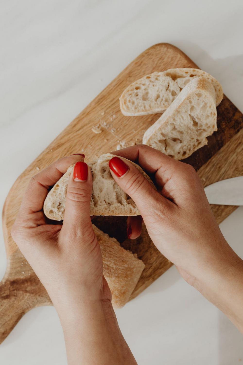 Woman making bruschetta with healthy ingredients Woman making bruschetta with healthy ingredients
