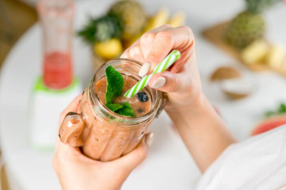 Refreshing Homemade Fruit Smoothie in a Jar with Straw and Mint Refreshing Homemade Fruit Smoothie in a Jar with Straw and Mint