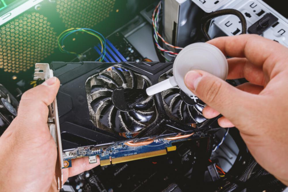 Cleaning dust from graphics card inside computer Cleaning dust from graphics card inside computer
