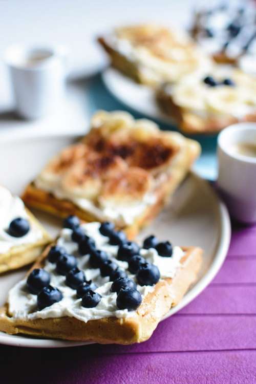 Banana and bluberries waffles with espresso