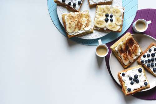 Banana and bluberries waffles with coffee espresso