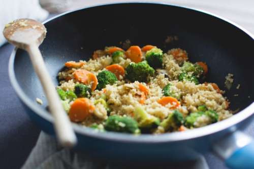 Cous cous with vegetables in a pan