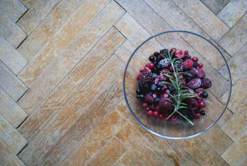 Frozen berries on a wooden floor