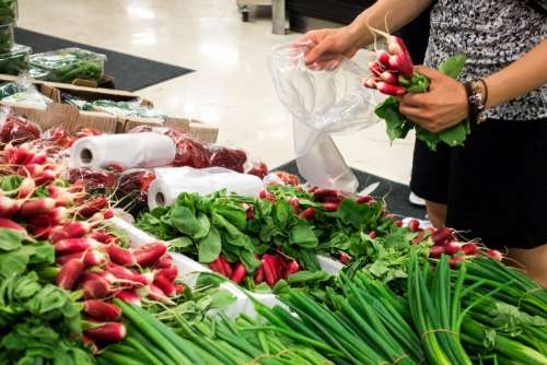 Girl buying radishes