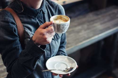 Girl drinking cappuccino