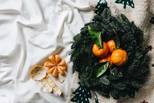 Tangerines on a simple natural Christmas wreath