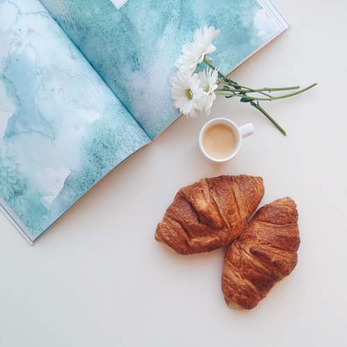 Relaxing with croissants and coffee espresso at home