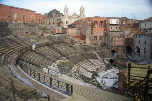 The Church of Saint Francis of Assisi backs the Cavea of the Greek-Roman Theatre in Catania, Italy free photo