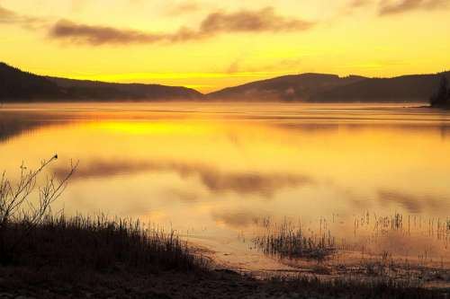 Fog and Mist over the lake landscape at Sunset free photo