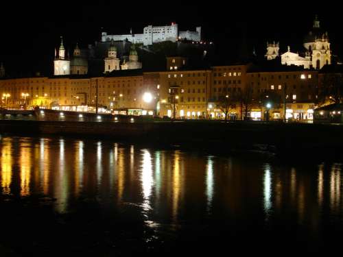 The fortress, Cathedral, and river at night in Salzburg, Austria free photo