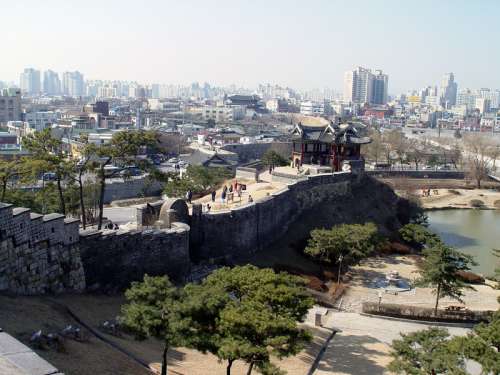 Hwaseong Fortress and the skyline of Suwon in South Korea free photo