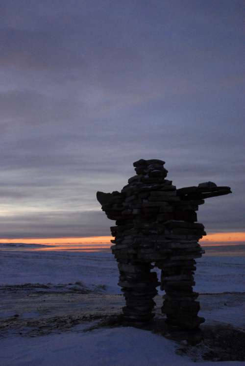 Inuksuk in the Tundra Landscape in Quebec, Canada free photo
