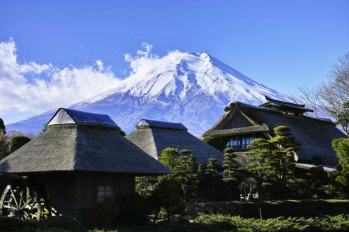 Mount Fuji rising above houses in Japan free photo