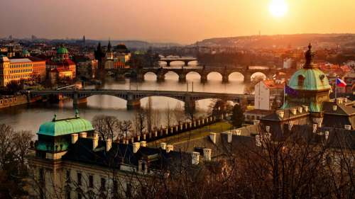 Prague panorama at sunset with orange sky in Czech Republic free photo