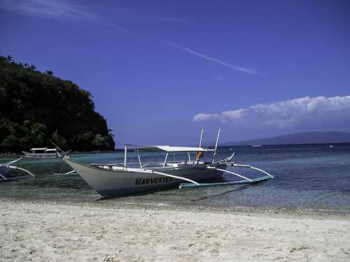 Puerto Galera with a boat in the sea free photo
