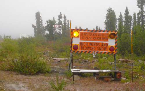 Road sign on Dempster Highway, Eagle Plains in the Yukon Territory free photo