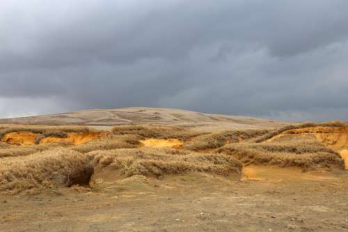 Sand Dunes Under the Cloudy Skies in Hawaii free photo