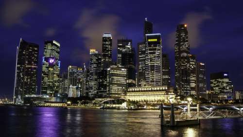 Singapore Skyline with dark blue sky in the background at night free photo