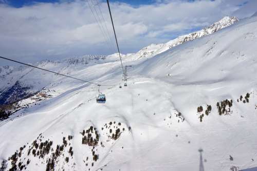 Ski Lifts on the snowy mountain side free photo