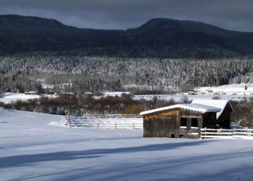 Snowy winter landscape with houses in British Columbia, Canada free photo