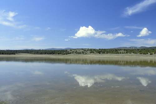 Wetlands across a pond in Montana free photo