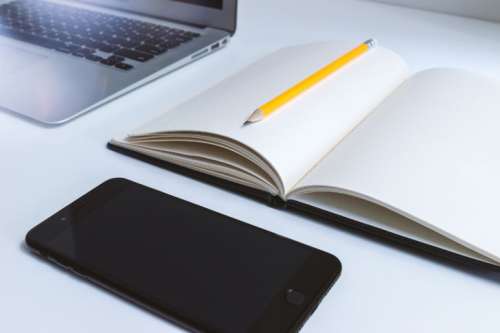 Work table in the office with laptop and smartphone