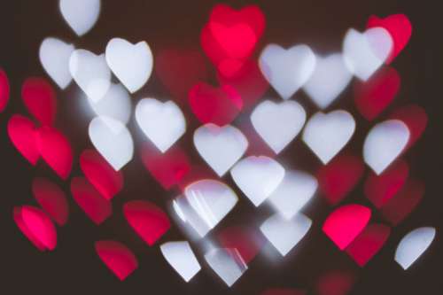 Pink heart bokeh background photo, abstract holiday backdrop