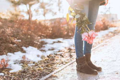 Young girl with roses on the street